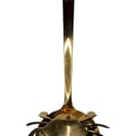 Sculpture of a brass crab with an underwater scene inside of the crab shell