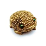 gold frog shaped compact with green eyes