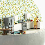 mini scene of a woman killing her husband in a kitchen