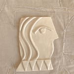 cream ceramic of side profile of a vase