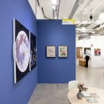 installation view of Hashimoto Contemporary booth at future fair featuring paintings on dark blue walls