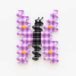 wooden sculpture of a purple by butterfly hanging on a wall by casey gray