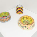 installation view of artist AP Shrewsbury's ceramic dog bowls on a pedestal, installed at Hashimoto Contemporary San Francisco