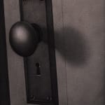 black and white painting of a close of of a door knob