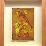 orange and yellow toned painting of a bird figurine on a branch