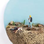 mini scene of a man killing another in a desert like landscape