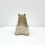 Ceramic sculpture of a bear sitting