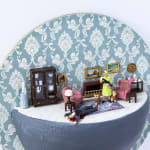 miniature diorama by Abigail Goldman of the Queen of England holding a rifle and standing next to a man bleeding on the floor