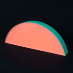 Rachel Strum - epoxy neon sculpture of horizontal strip of a round panel top edge - orange and Turkish green.
