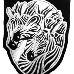 embroidered black and white banner of three zebra