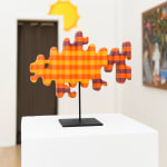 photo of a wooden sculpture in the shape of a goldfish by Casey Gray