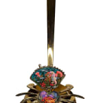 Sculpture of a brass crab with an underwater scene inside of the crab shell