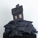 Tania Alvarez sculpture of house on bed of hands