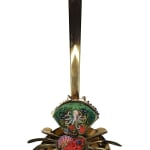 Sculpture of a brass crab with an underwater scene inside of the crab shell