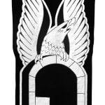 embroidered black and white banner of an eagle over a doorway