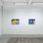 installation of Gina M. Contreras exhibition - two paintings of nude female figures with patterned blankets. From left to right "Every Little Bit Hurts," and "Pensive Pleasure."