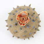 Jen Dwyer sculpture - round brown spiky plant with flower on top