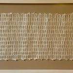 Beige woven horizontal rectangle in a frame