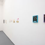 white gallery walls with assorted small artworks