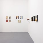 white gallery walls with small artworks