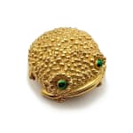 gold frog shaped compact with green eyes
