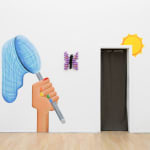 wooden sculpture of a purple by butterfly hanging on a wall with a mural by casey gray