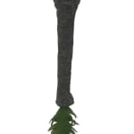 Elephant trunk made from wool and felt with a fern at the end