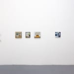 white gallery wall with small assorted artwokrs
