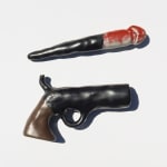 ceramic sculpture of a gun with a penis coming out of the barrel