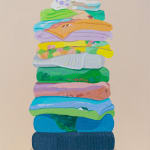 Danym Kwon painting of stacked folded sheets with patterns, trees, florals, etc
