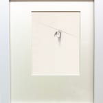 framed drawing of a figure hanging from a line