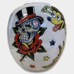 white ceramic vase by artist AP Shrewsbury with a skull, mickey mouse-esque figure, and other glazed details
