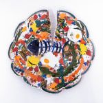 Sculpture of three blue birds holding a plate of food and various things on their backs