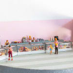 miniature diorama by Abigail Goldman of human body parts in bakery shop cases