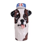 ceramic sculpture of a brown, black, and white dog with its tongue sticking out wearing a blue baseball cap by Katie Kimmel