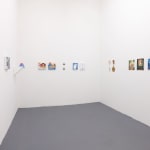 white gallery walls with assorted small artworks