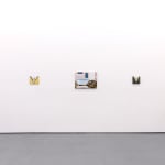 White gallery walls with paintings of various sizes by Angela Burson