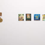 white gallery wall with small assorted artworks