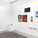 Installation view of a gallery wall with various artworks installed in a salon-style at Hashimoto Contemporary San Francisco