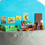 miniature diorama by Abigail Goldman of a woman and her three cats next to a bloody dead man