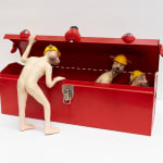sculpture of three nude anthropomorphic dogs with construction hats, two are having sex inside of a toolbox and one is peering inside