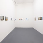 white gallery walls with small artworks
