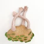 sculpture by Jen Dwyer of light pink tentacle like objects emerging from brown mound with green leafs