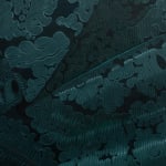 Detail photograph of the ornate teal silk fabric by Sabrina Bockler
