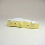 Stephen Morrison "Camembert" ceramic sculpture of realistic brie cheese with eyes and mouth
