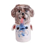 Ceramic vessel depicting two dog heads stacked on top of one another, with one dog drooling down onto the other by Katie Kimmel