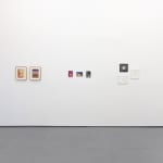 gallery wall with assorted small artworks