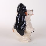 Katie Kimmel - ceramic sculpture of a black and white basset hound standing on its hind legs