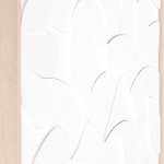 all white wooden relief piece made of many small pieces in a light wood frame side angle