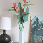 wooden sculpture of birds of paradise flowers in a square vase by Jeff Canham